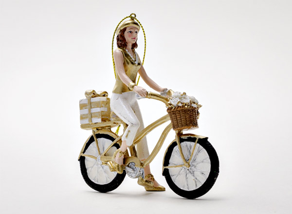 Christmas tree toy Girl on a bicycle with a gift