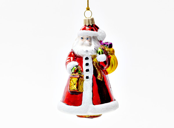 Christmas tree toy Santa Claus with a bag and a lantern
