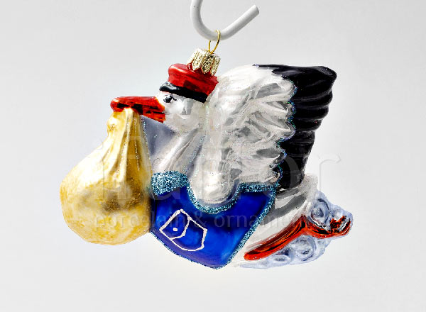 Christmas tree toy in a gift box Stork with baby