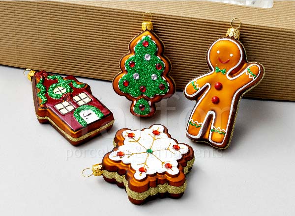 Set of Christmas tree toys in a gift box Four gingerbread 